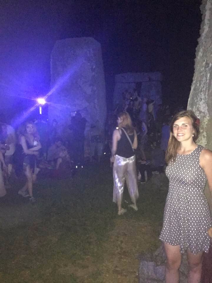 Touching the stone at the Summer Solstice!